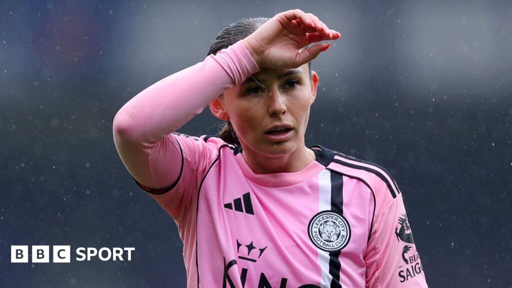Hannah Cain with hand across forehead