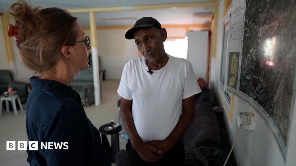 engrab or report showing Lucy Williamson speaking to Bedouin community leader Eid Khamis