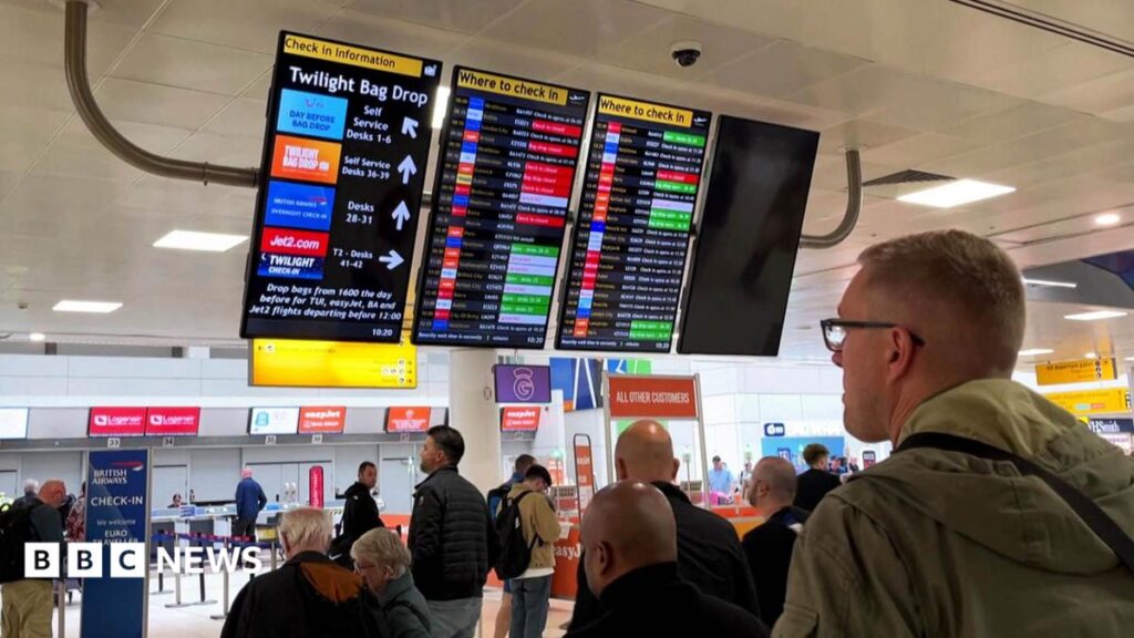 Flight disruption: Airlines criticise air traffic control over second glitch in a month A woman and two girls, wearing minnie mouse ears.