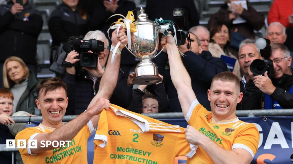 Stephen McConville and Charlie Carr lift the Frank O'Hare Cup