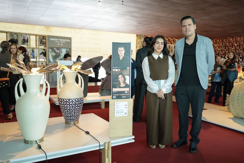 Mexican artisans team up with Middle Eastern, South Asian designers in CDMX Two designers stand next to their artworks in a gallery.