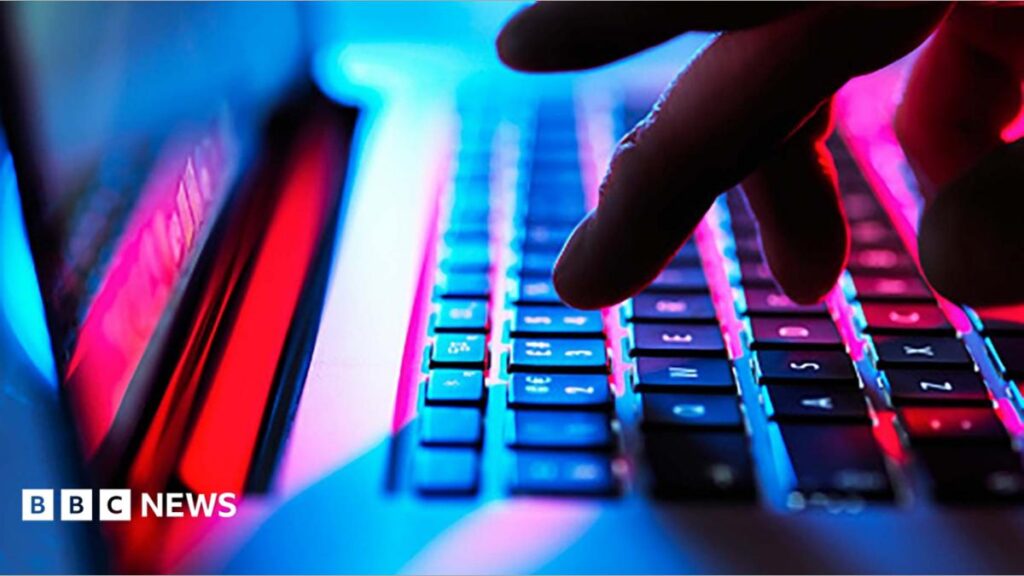 PHP: What is it and why did it spark a global cyber security scramble? Somebody holding up a smart-phone in their right hand. The screen is black with 'Revolut' written in white letters.
