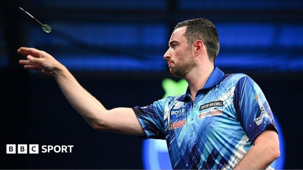 Luke Humphries throws a dart during the World Grand Prix final against Gerwyn Price